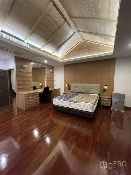 Home Office for rent or sale in Phra Khanong, Bangkok - Master bedroom angle with built-in vanity, bedside tables and soft lighting.