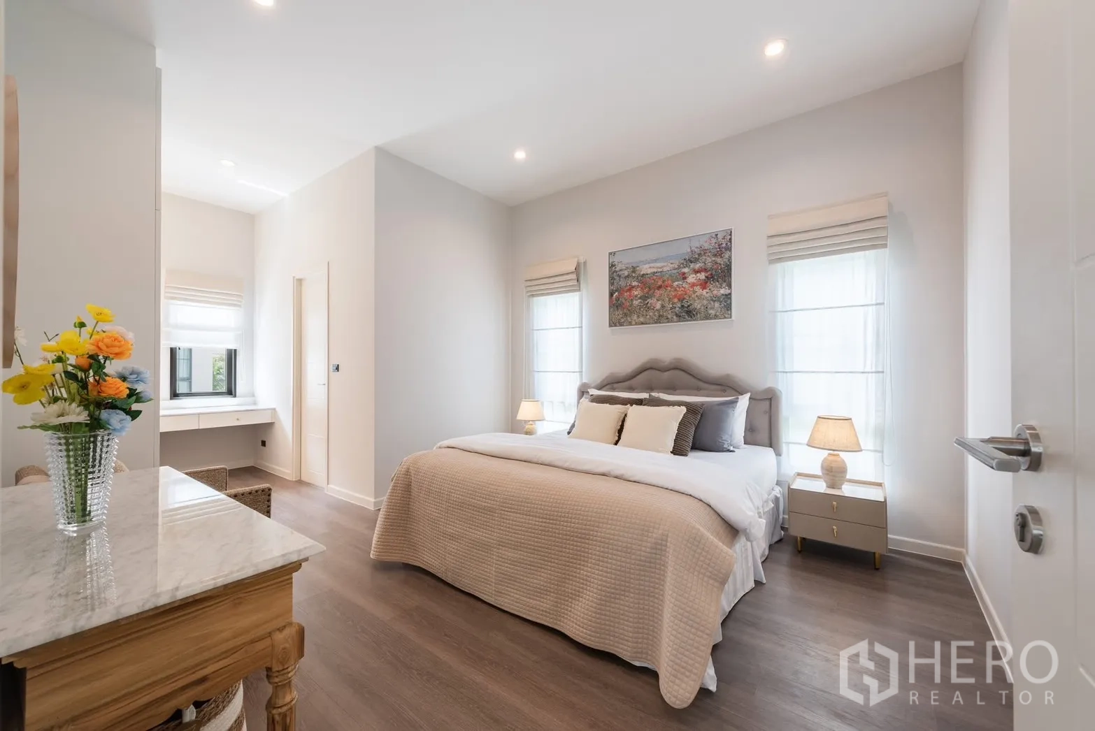 Detached House for rent or sale in Bang Phli, Samut Prakan - Wide view of a cozy bedroom with large bed and corner reading nook.