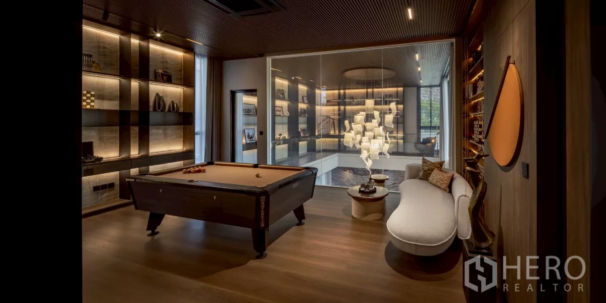 Detached House for rent in Saphan Sung, Bangkok - Entertainment room with pool table, custom shelving and view over the living room void.