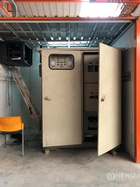 Warehouse for rent in Samut Prakan - Electrical control cabinet and wiring area inside the industrial warehouse.