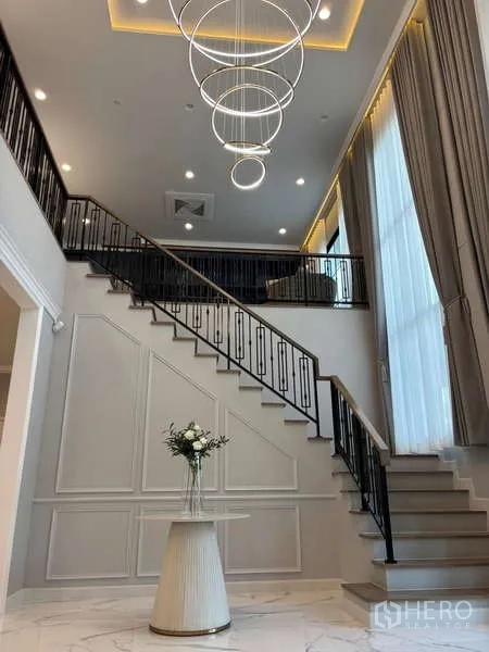 Detached House for rent in Bang Phli, Samut Prakan - Grand staircase and double-height entrance hall with circular pendant lights.