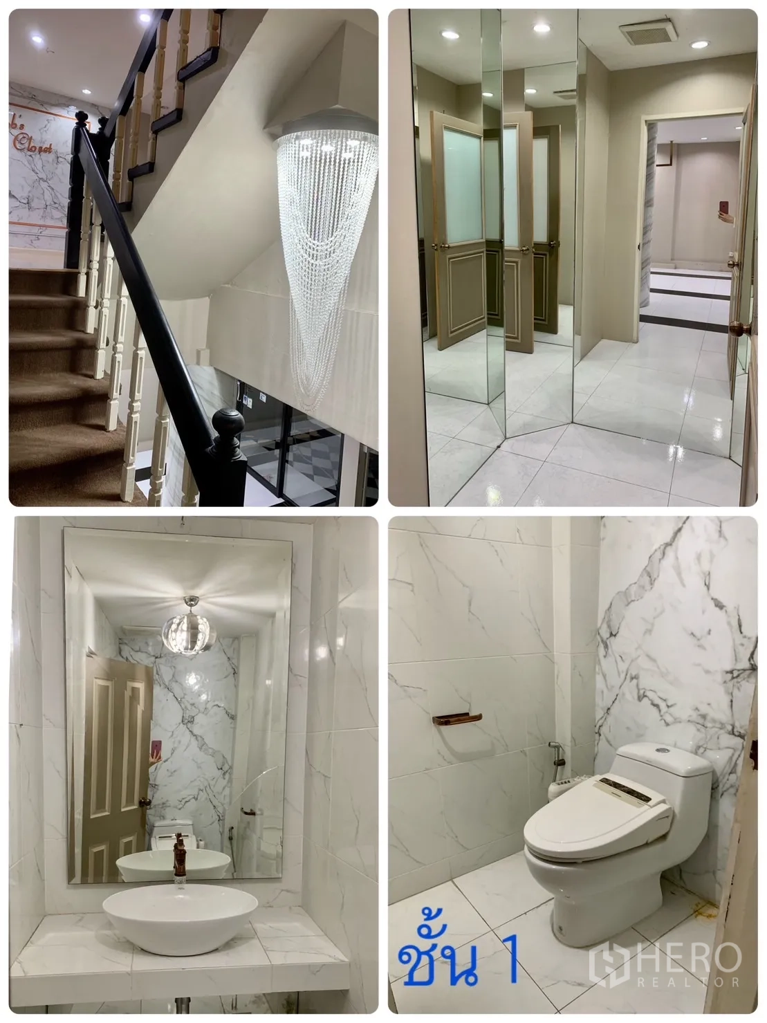 Home Office for rent in Watthana, Bangkok - Ground-floor lobby with staircase, crystal chandelier, mirrored walls and marble-style tiled restroom.