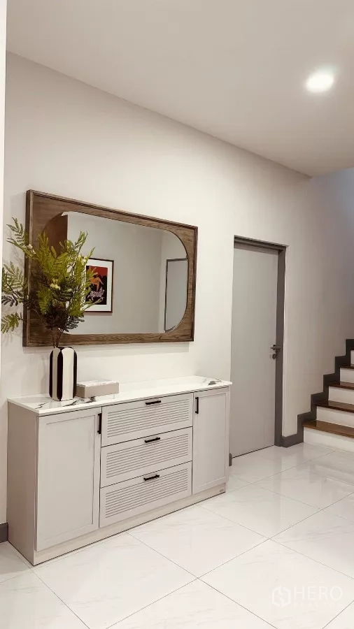 Detached House for rent in Bang Phli, Samut Prakan - Entrance console with a large mirror and white cabinet next to the stairs.