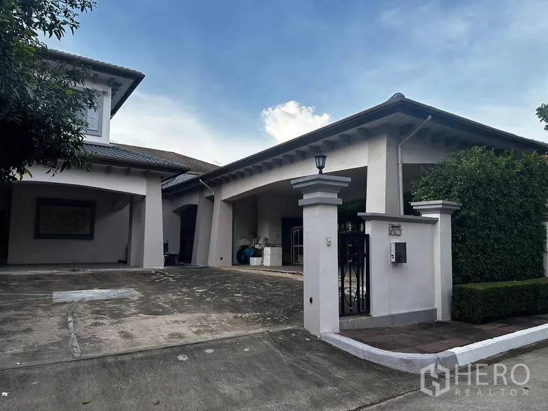 Detached House for sale in Bang Khun Thian, Bangkok - Gated driveway with wide carport at the front of the property.