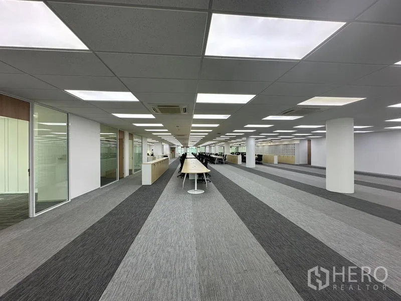 Office Space for rent - Casual lounge with built-in bench seating in yellow and gray cushions.