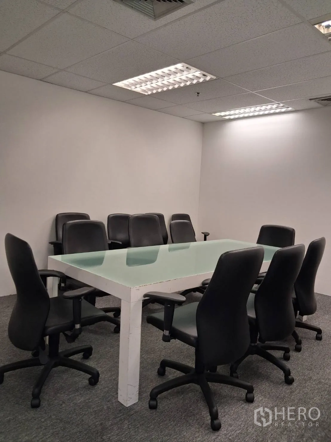 Office Space for rent in Sathon, Bangkok - Enclosed meeting room with large glass-top table and several executive chairs.