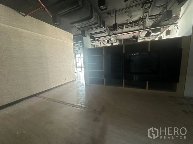 Office Space for rent in Bang Rak, Bangkok - Quiet back section with storage cabinetry and industrial exposed ductwork.