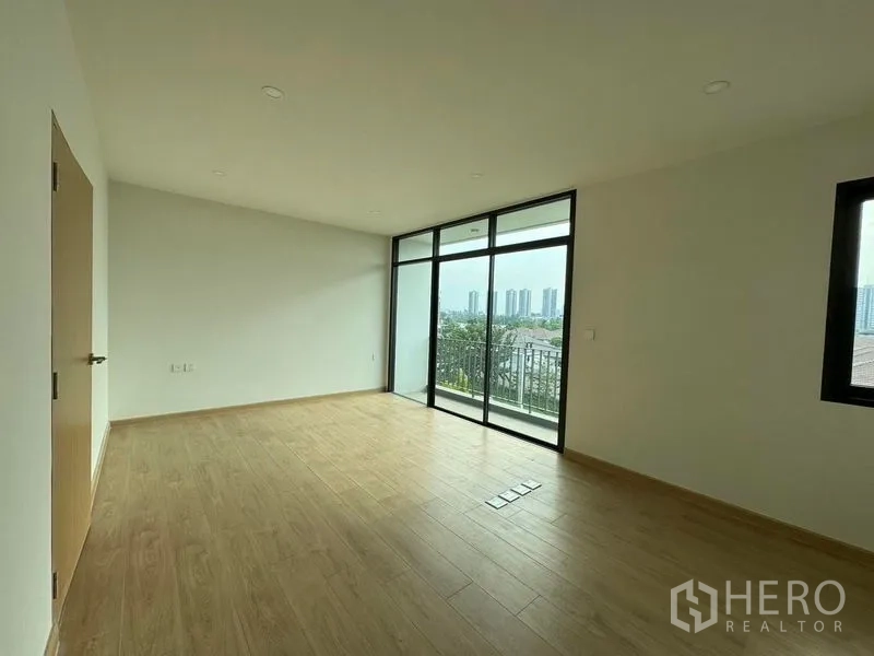 Home Office for rent in Pak Kret, Nonthaburi - Corner room with full-height windows and a city-view balcony