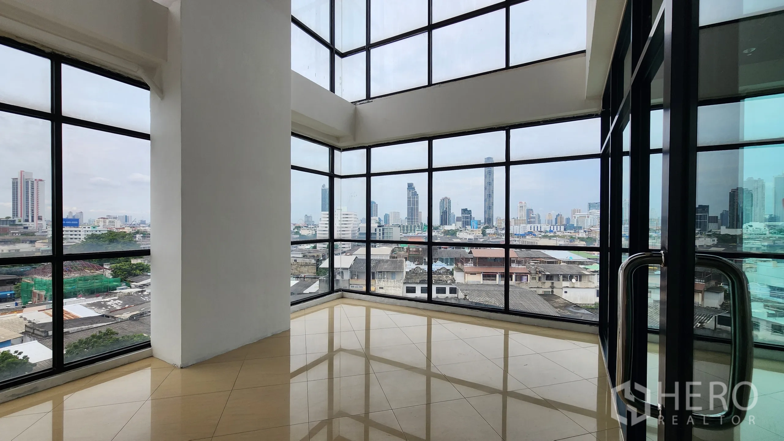 Office Space for rent in Yan Nawa, Bangkok - Open-plan office with windows on both ends and glass wall to meeting room.