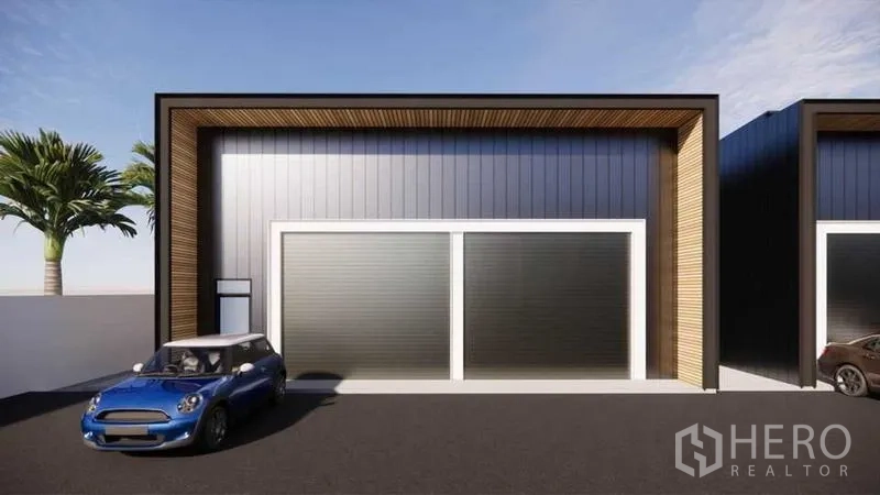 货栈 出租 - 苏安隆曼谷现代仓库外立面，双宽卷闸门、金属墙面与停车空间