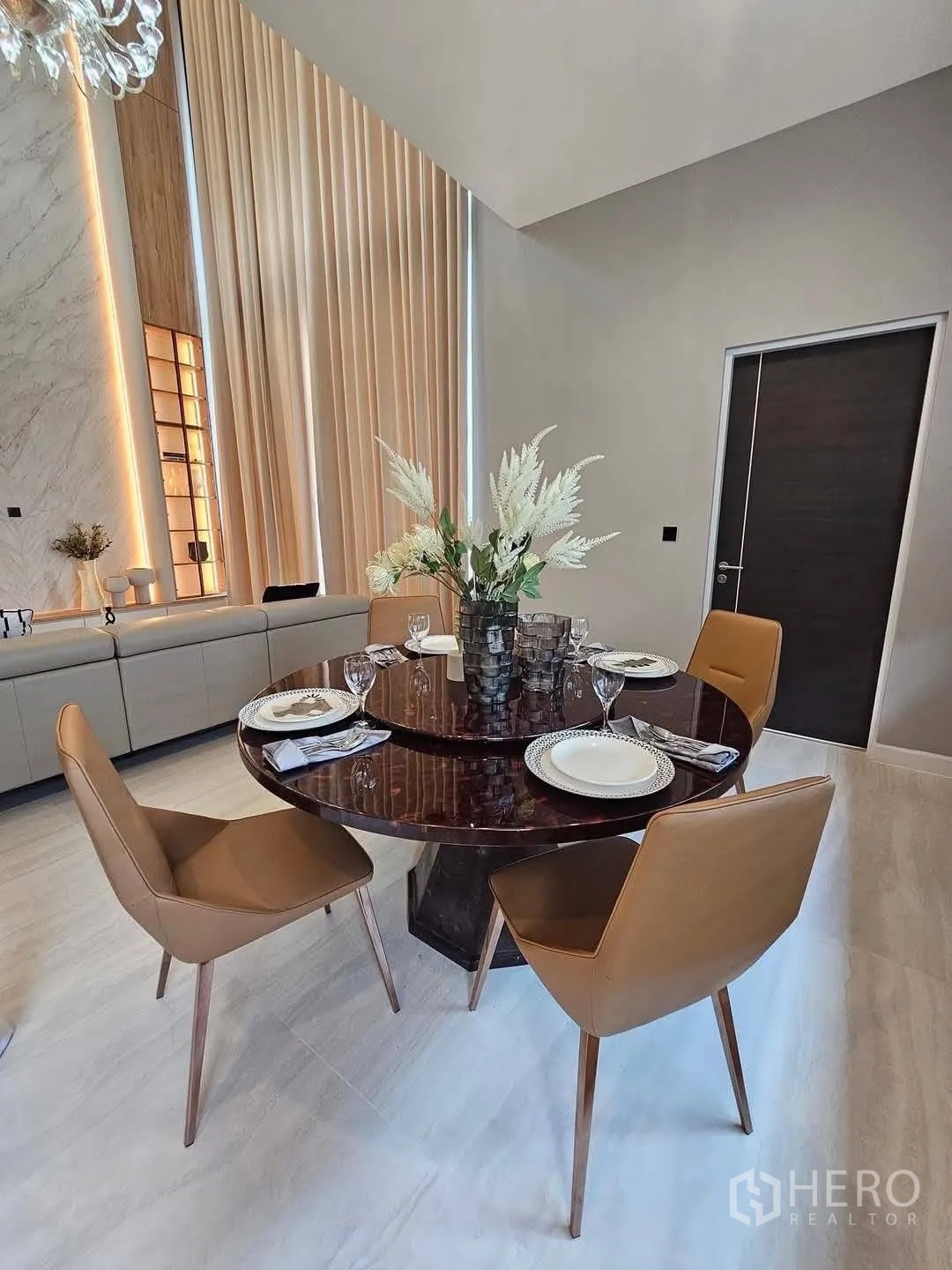 Detached House for rent or sale in Suan Luang, Bangkok - Dining area with round table set for four and contemporary chairs.