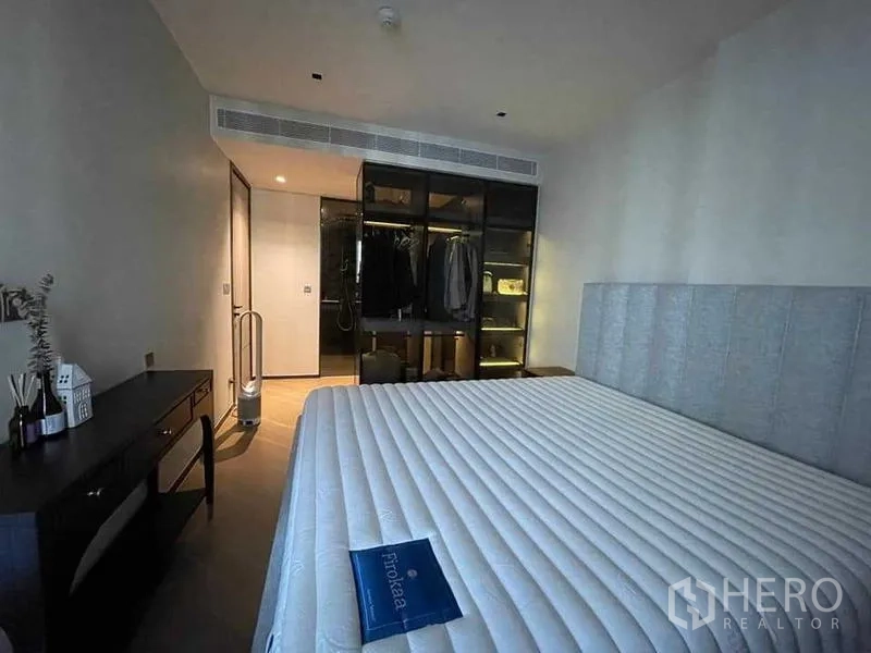 Condominium for rent or sale - Primary bedroom with open wardrobe and ensuite access