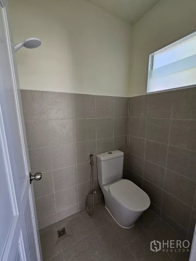 Detached House for rent in Bang Phli, Samut Prakan - Maid’s bathroom with toilet and shower area.