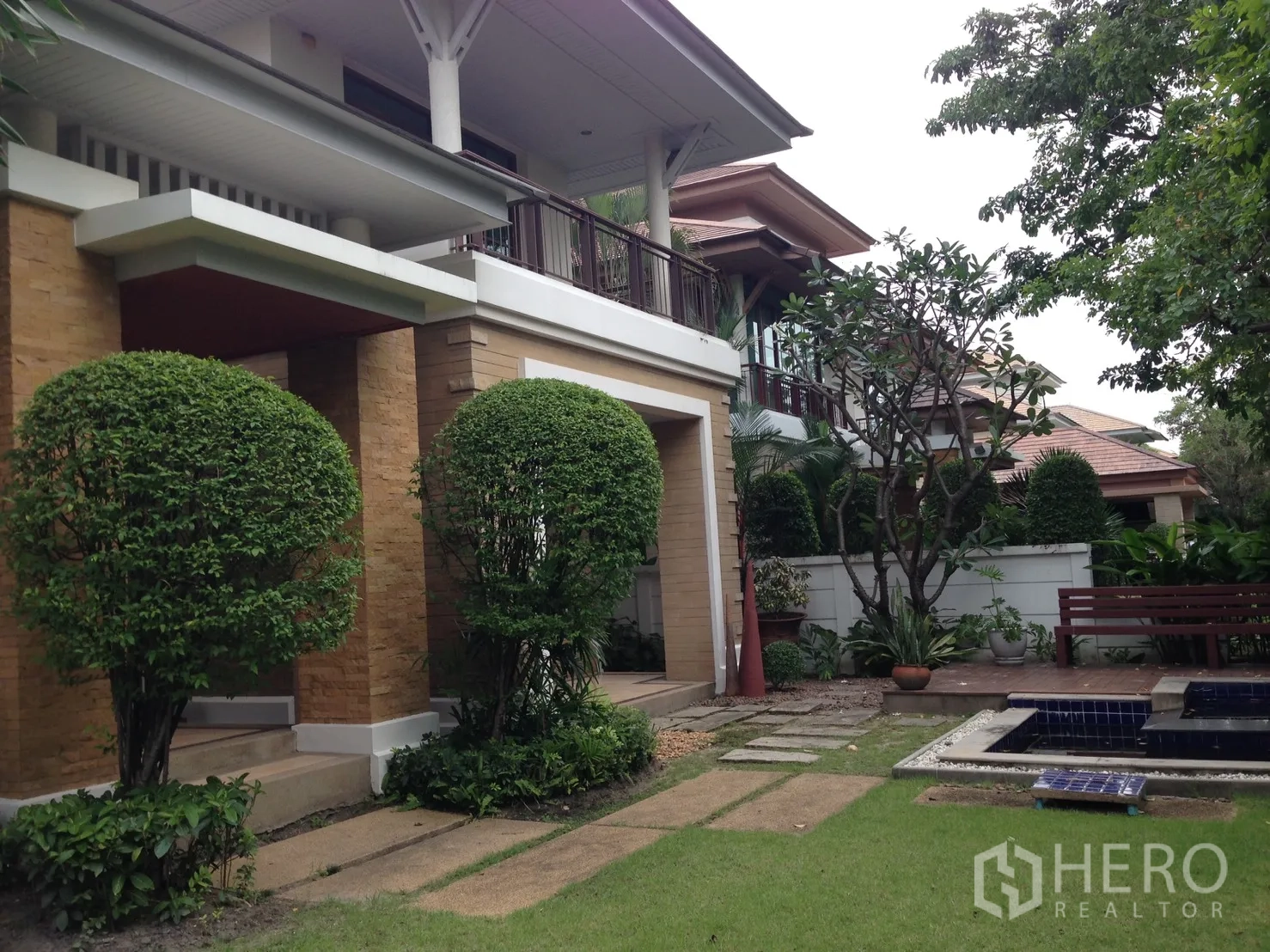 Detached House for rent or sale in Suan Luang, Bangkok - Two-storey detached house with landscaped garden, topiary trees and stone path.