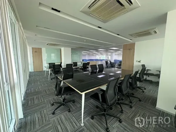 Office Space for rent - Spacious office floor with modular workstations, carpet tiles and ceiling cassette air-conditioning.