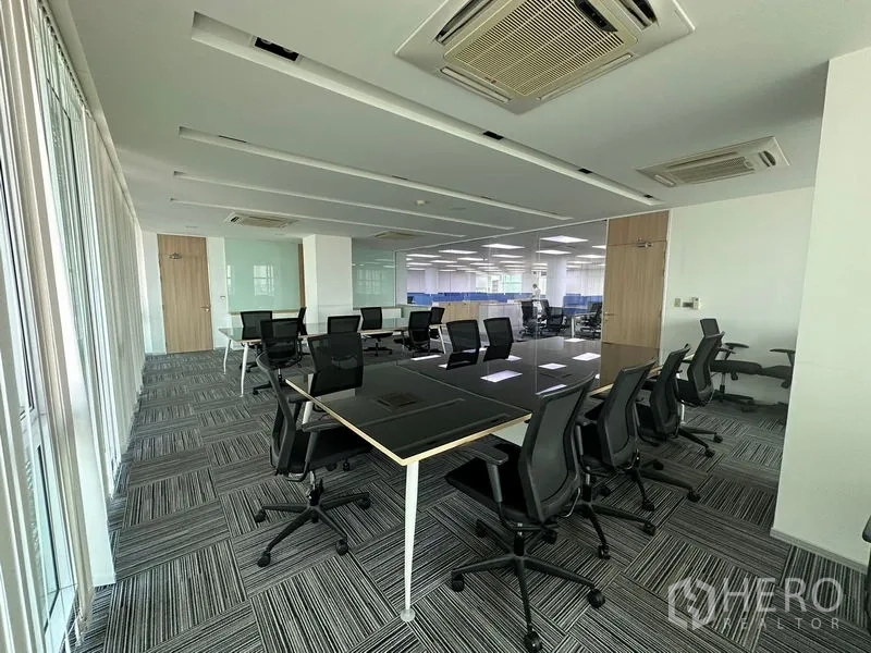 Office Space for rent - Spacious office floor with modular workstations, carpet tiles and ceiling cassette air-conditioning.