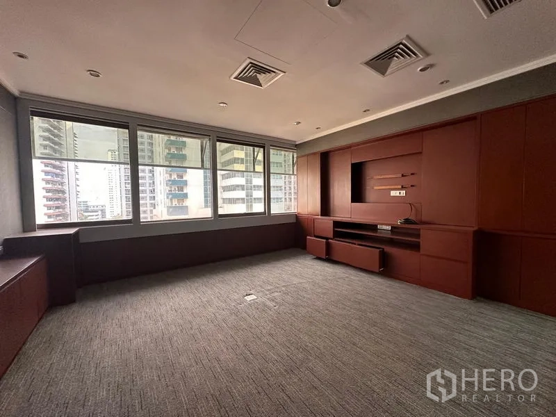 Office Space for rent in Watthana, Bangkok - Executive office with wood built-in media wall and skyline windows