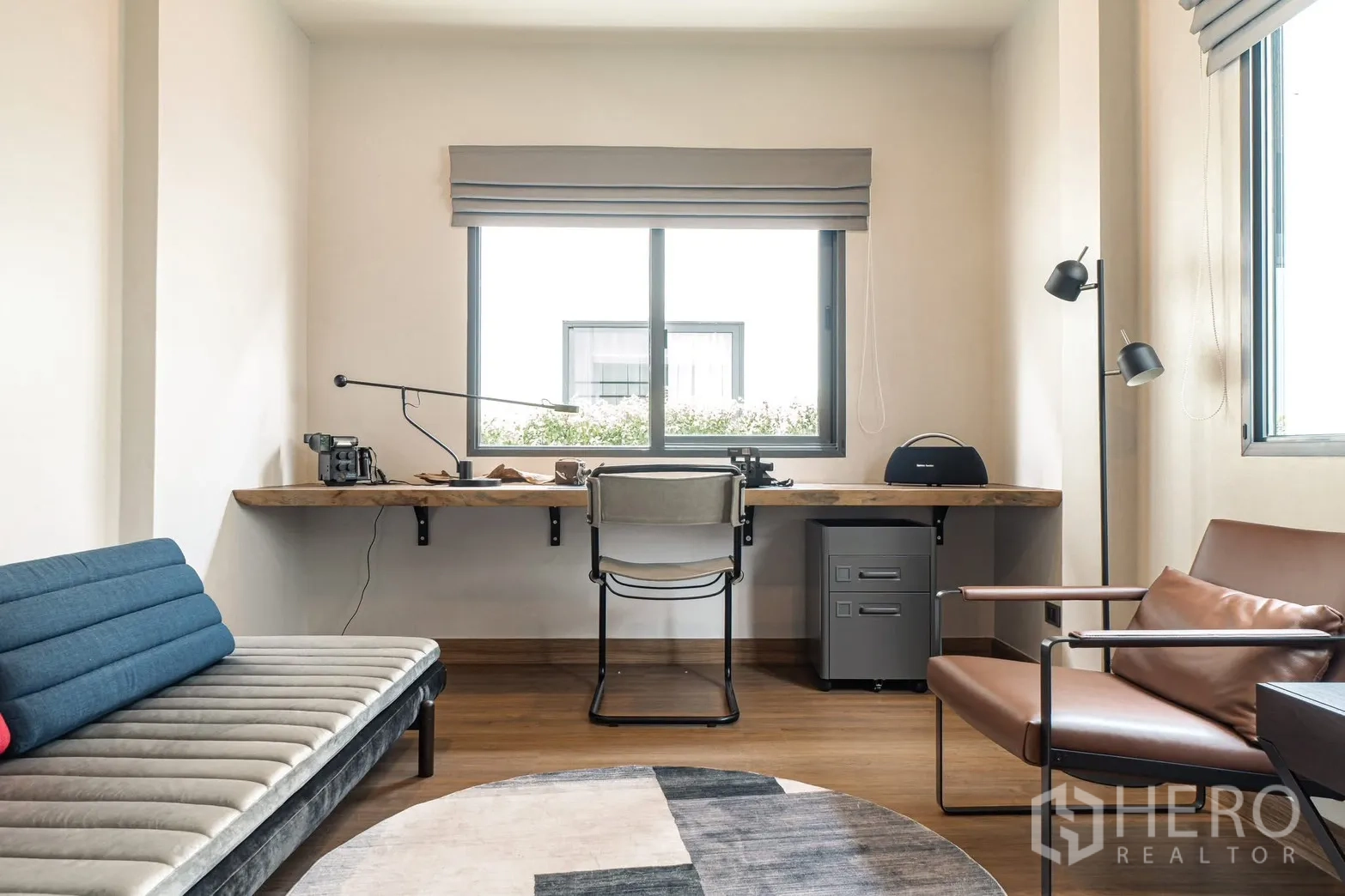 Detached House for rent in Bang Phli, Samut Prakan - Work zone with long timber desk, chair, daybed, and floor lamp.