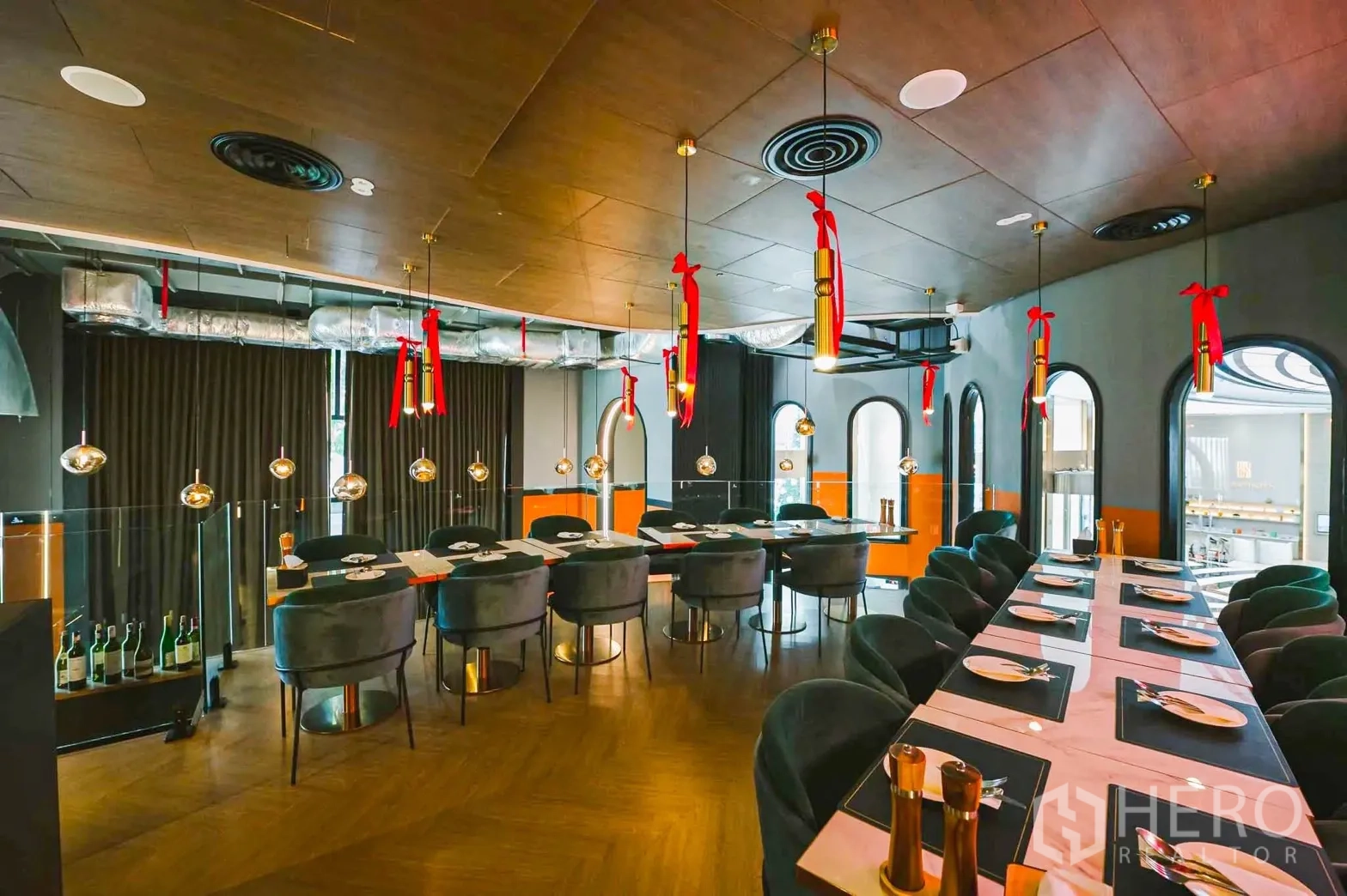 Retail Space for rent in Bang Rak, Bangkok - Upper dining room with long tables, velvet chairs, and pendant lighting.
