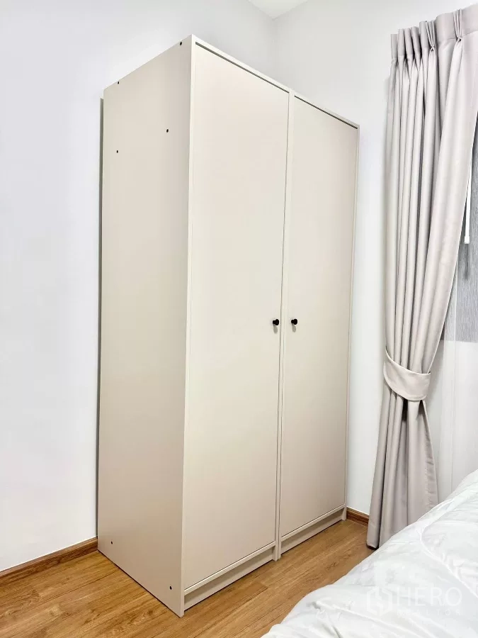 Townhouse for rent in Bang Phli, Samut Prakan - Second bedroom wardrobe beside curtained window.