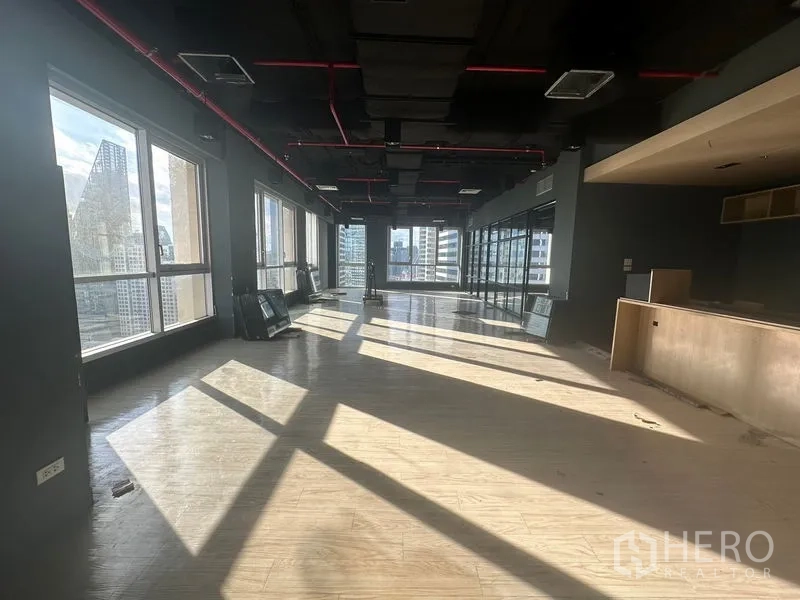 Office Space for rent in Bang Rak, Bangkok - Long rectangular workspace with large windows on both sides overlooking Sathorn towers.