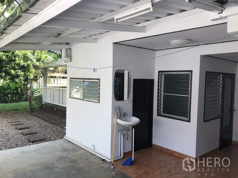 Detached House for rent in Suan Luang, Bangkok - Covered carport and service area with windows and outdoor sink