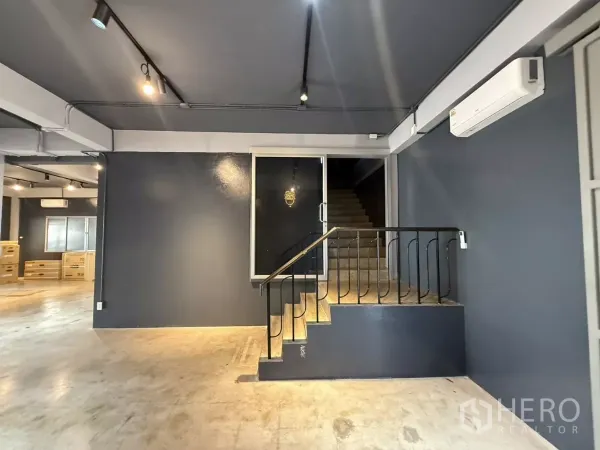 Office Space for rent in Wang Thonglang, Bangkok - Entrance area with glass door and stairs inside the office space.