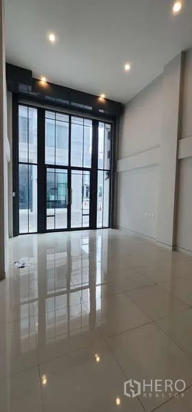 Home Office for rent - Tall glass frontage bringing natural light into the ground-floor workspace.