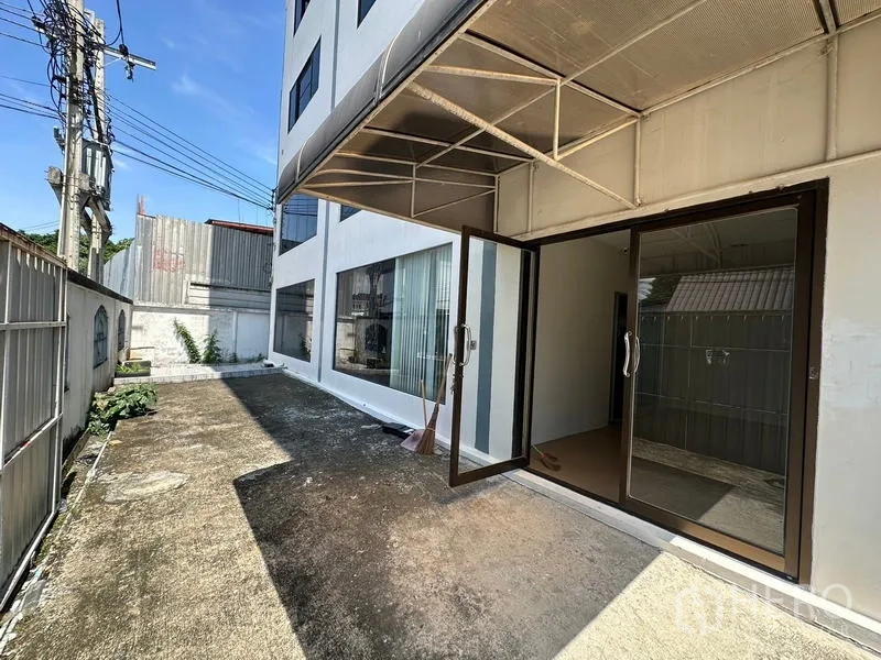 Office Space for rent - Ground-floor entrance with sliding glass doors and covered awning.
