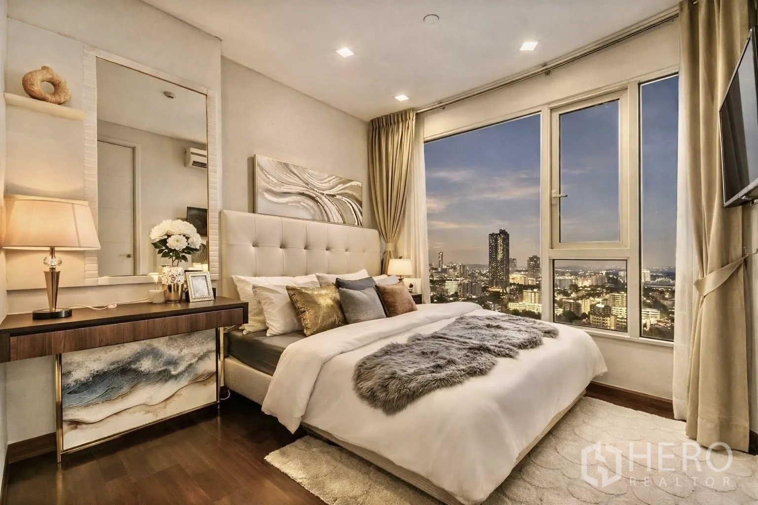Condominium for rent or sale in Watthana, Bangkok - Corner bedroom view at dusk through large floor-to-ceiling windows.
