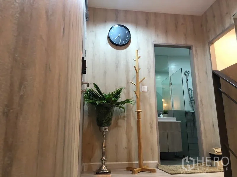 Condominium for rent or sale in Phra Khanong, Bangkok - Upper landing leading to a bathroom with glass shower enclosure and vanity.