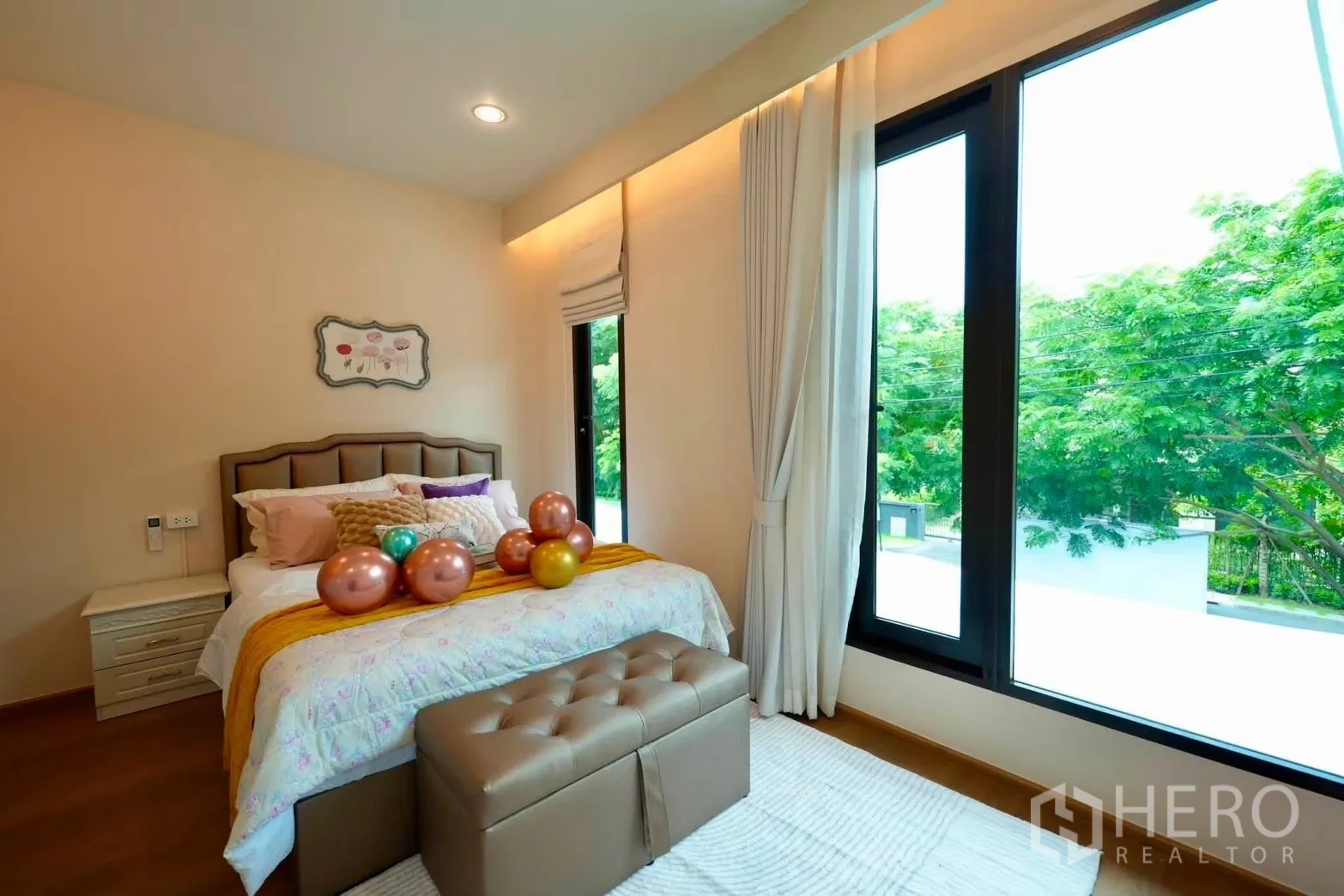 Detached House for rent in Bang Phli, Samut Prakan - Bedroom with large windows, bed, and garden views.