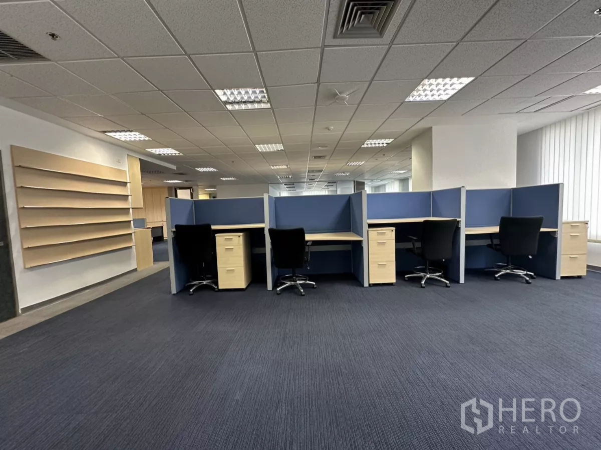 Office Space for rent in Watthana, Bangkok - Row of cubicles with chairs and storage shelves on the side wall.