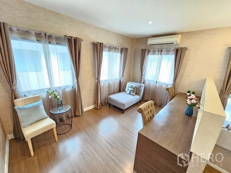 Detached House for rent in Prawet, Bangkok - Sunlit multipurpose room with chaise lounge, curtains, and corner seating.