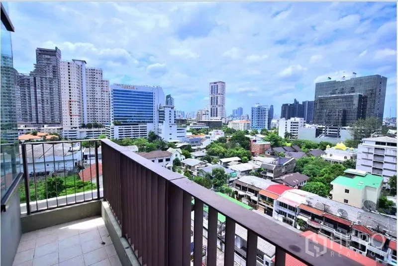 Condominium for rent or sale in Khlong Toei, Bangkok - Balcony overlooking the city skyline with wide Sukhumvit views.