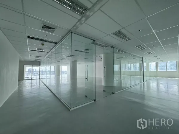 Office Space for rent in Sathon, Bangkok - Spacious 201 sqm office floor featuring full-height glass walls, large windows, and polished floors near BTS Saint Louis.