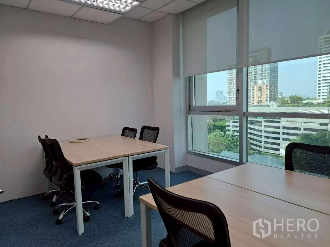 Office Space for rent in Sathon, Bangkok - Team room with paired desks, task chairs and bright windows overlooking the city.