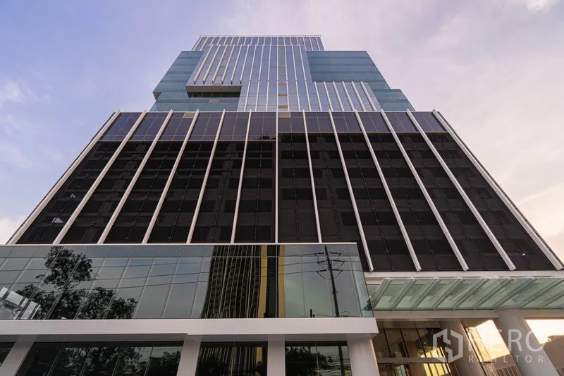 Office Space for rent in Sathon, Bangkok - Contemporary facade of a high-rise office building with vertical fins.