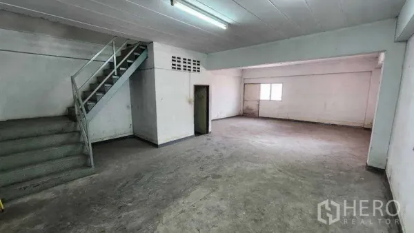 Warehouse for rent in Nong Khaem, Bangkok - Large internal office or workspace with stair access inside the warehouse.