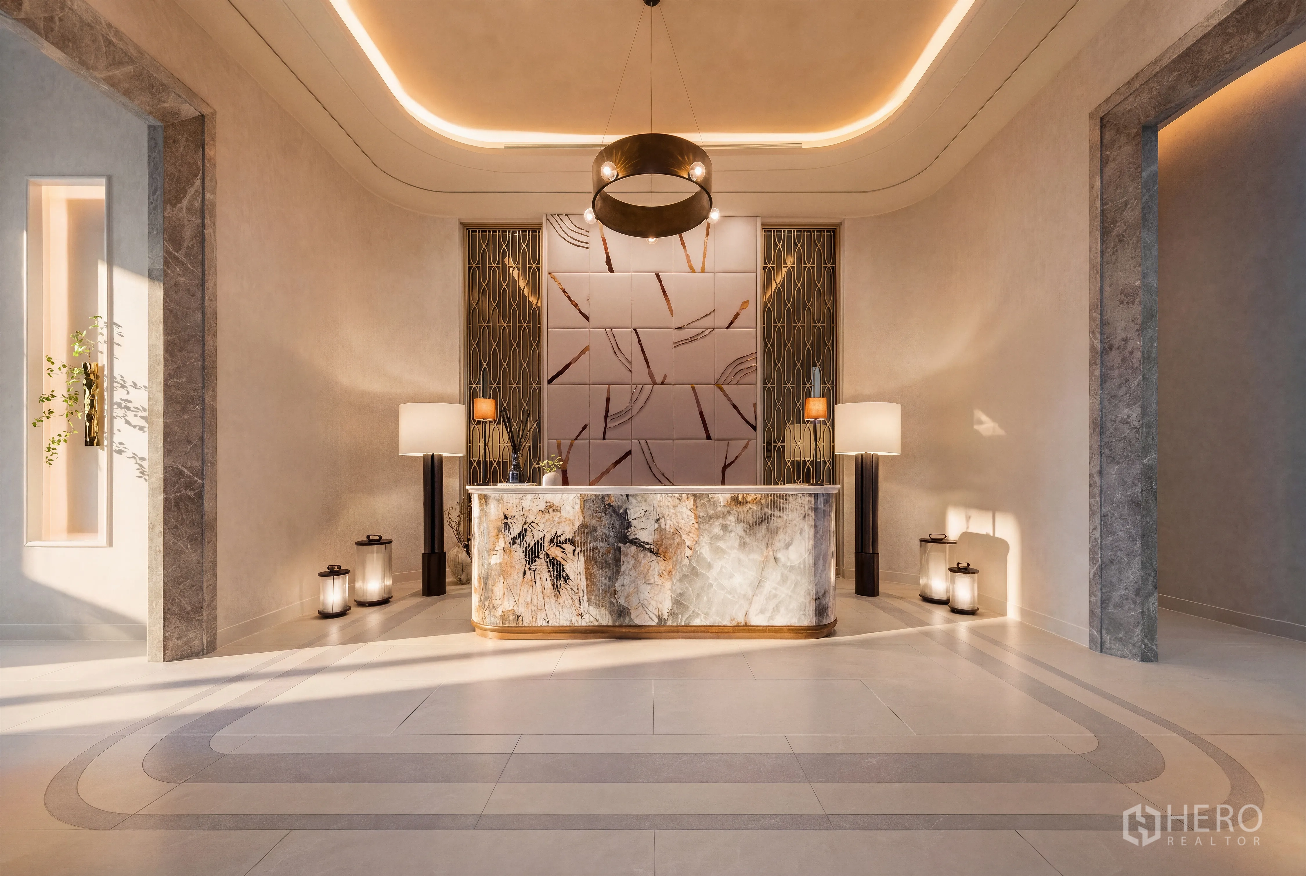 Condominium for sale in Khlong Toei, Bangkok - Elegant condominium lobby with marble reception desk, pendant chandelier, and modern decorative wall panels.