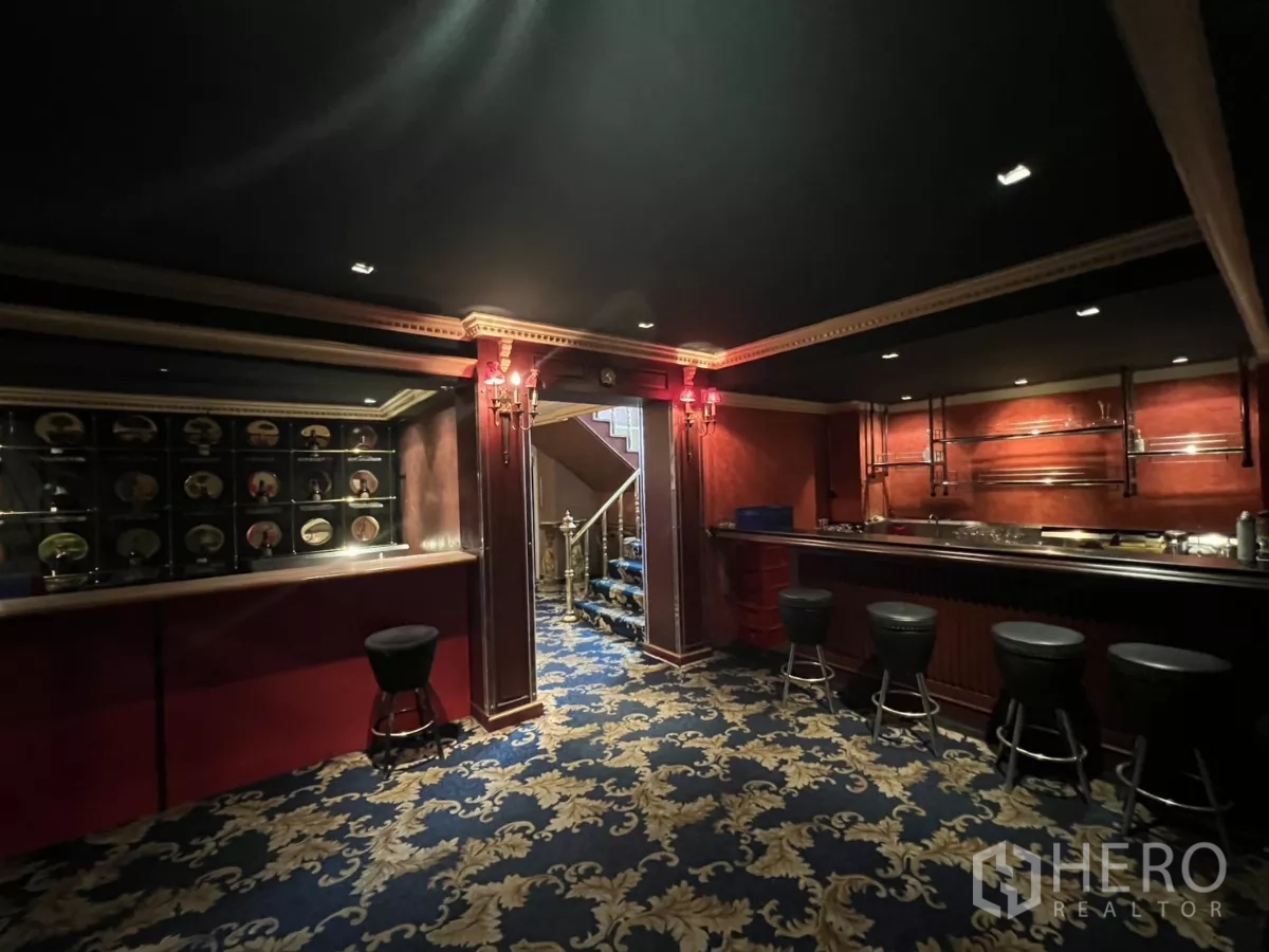 Retail Space for rent in Watthana, Bangkok - Back bar with stools, shelving and moody lighting.