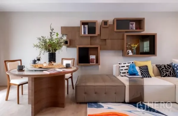 Townhouse for rent in Bang Phli, Samut Prakan - Close view of dining corner with ottoman bench and geometric wood wall shelves.