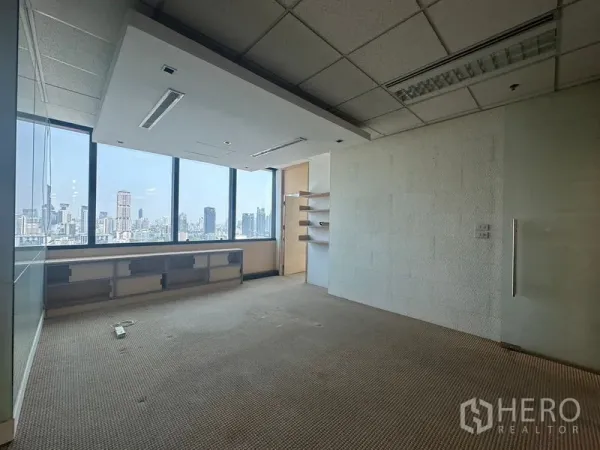 Office Space for rent in Khlong Toei, Bangkok - Bright meeting room with recessed ceiling feature and wide windows overlooking Bangkok’s skyline.