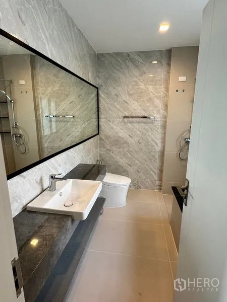 Detached House for rent or sale - Spacious bathroom with long vanity, wide mirror, shower area and toilet.