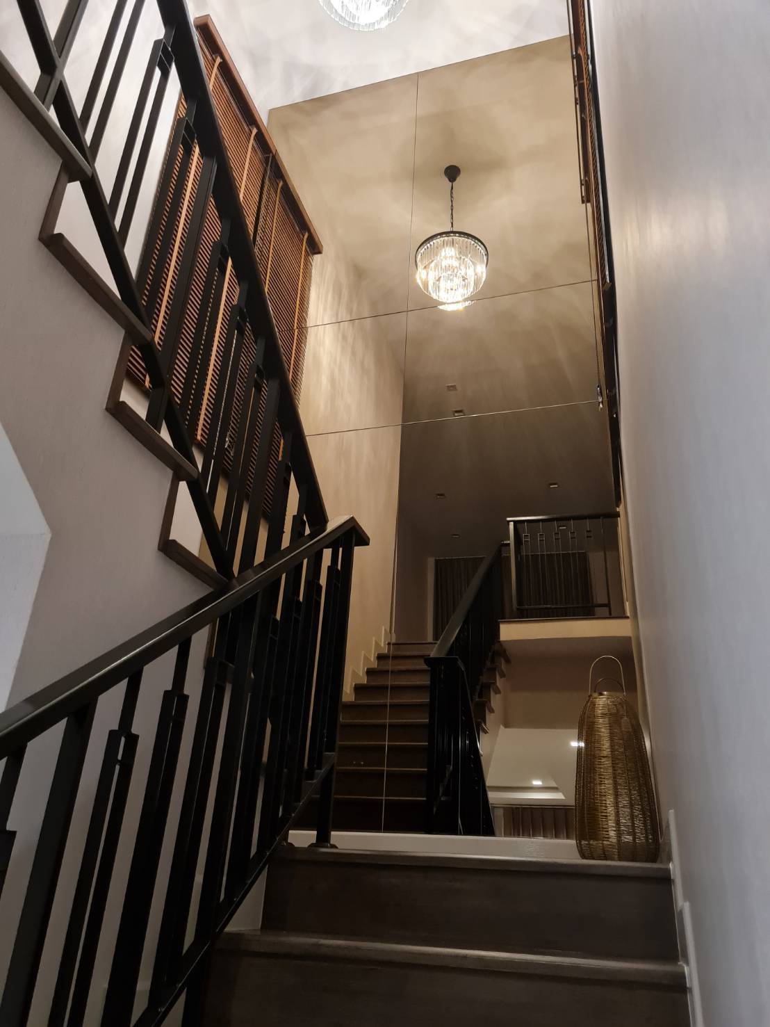 Detached House for rent in Saphan Sung, Bangkok - Staircase with dark wood steps, metal railings and pendant chandelier.