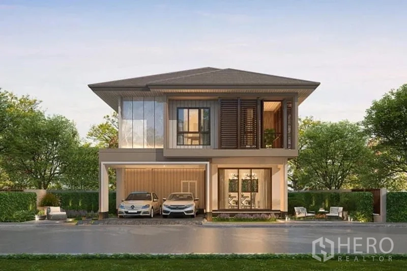 บ้าน ขายในBang Kapi, Bangkok - ภาพเรนเดอร์ด้านหน้า บ้านเดี่ยวสมัยใหม่พร้อมโรงจอดรถสองคันและจัดสวน