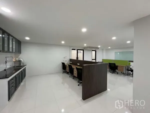 Office Space for rent in Prawet, Bangkok - Spacious office area with shared desks, kitchenette and ceiling downlights.