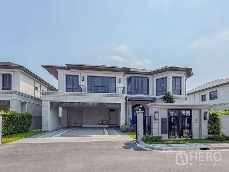 Detached House for rent or sale in Bang Kapi, Bangkok - Front elevation with gated entrance, driveway and covered parking.
