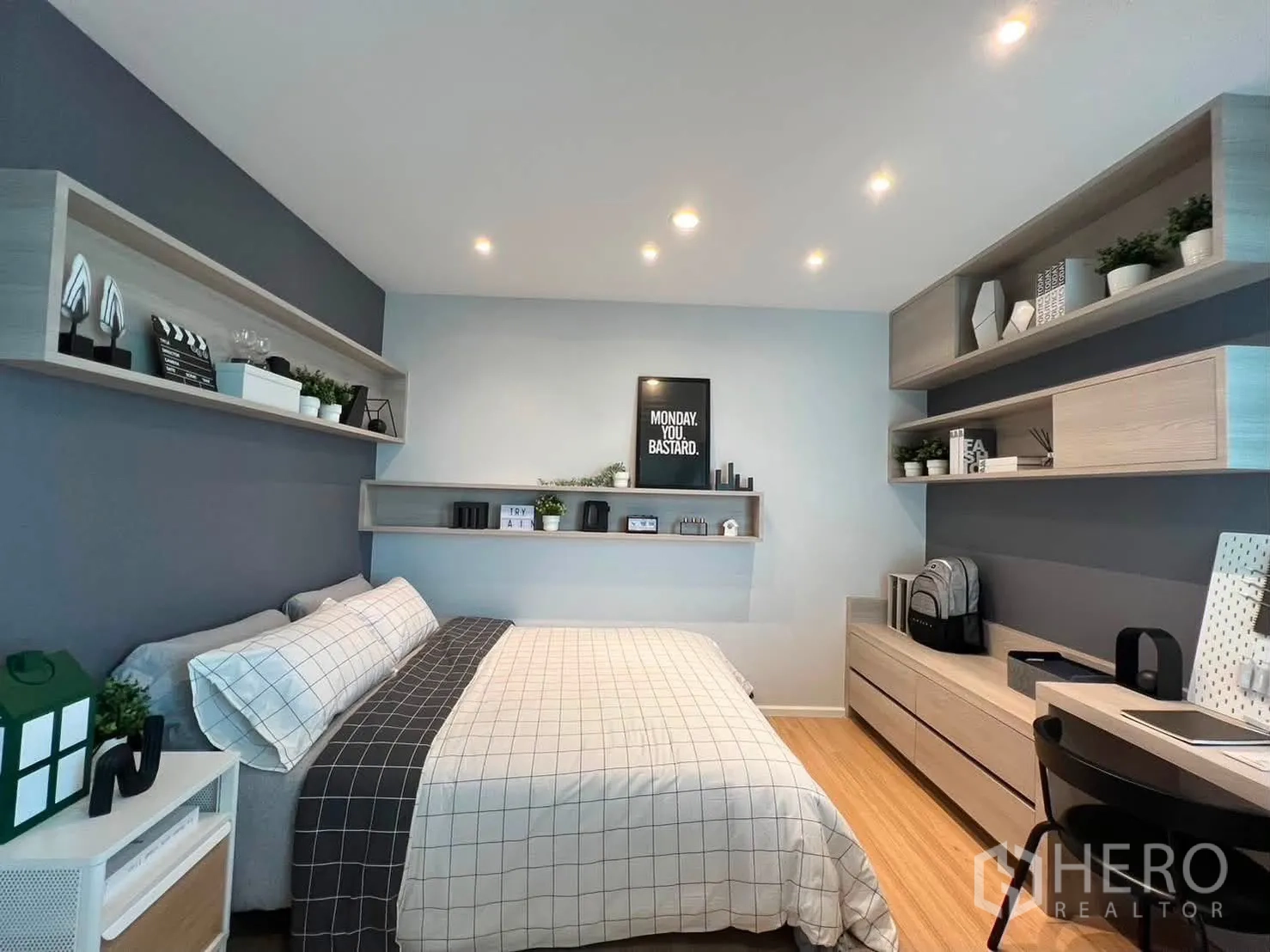 Townhouse for rent in Saphan Sung, Bangkok - Bedroom view showing wall-mounted shelves, built-in drawers, and recessed lights.