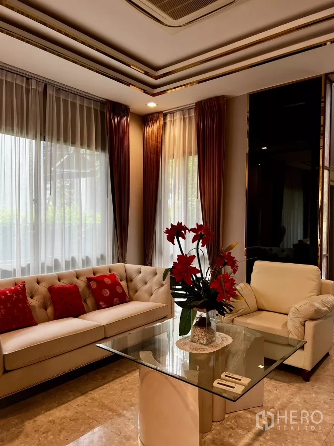 Detached House for rent or sale in Prawet, Bangkok - Luxury lounge view with recessed ceiling lights, large windows and plush seating.